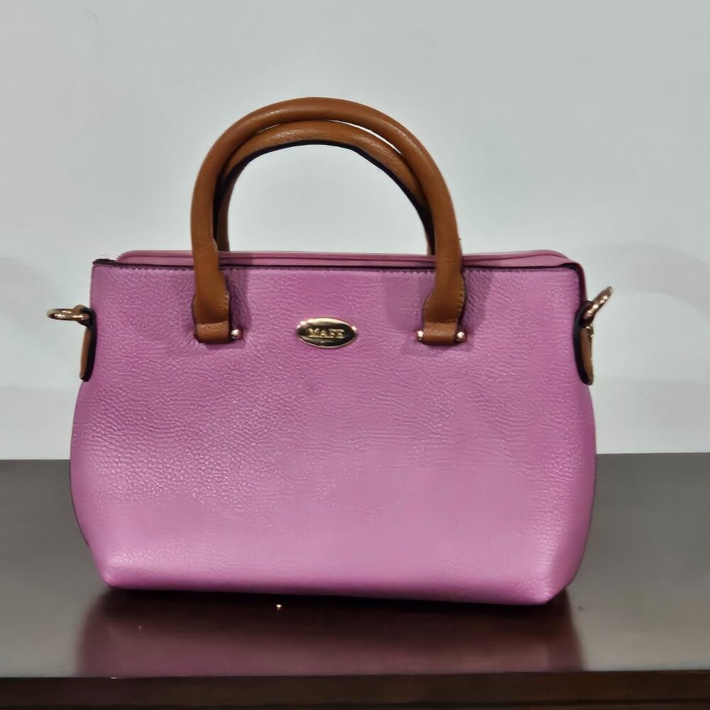 Mafe Purse Pink in color Gold color zipper and accents